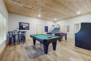 a room with a pool table and a slide at Sweet Retreat in Sevierville