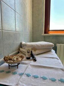 Postel nebo postele na pokoji v ubytování B&B SGUARDO AL CONERO