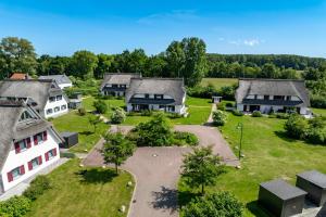 an aerial view of a house with a yard at Feriendorf Am Mariannenweg Reethaus 14b in Boltenhagen