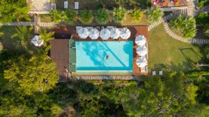 an overhead view of a swimming pool with umbrellas at Lov Faralya Adults Only in Faralya