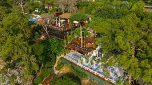 an aerial view of a mansion with a train at Lov Faralya Adults Only in Faralya