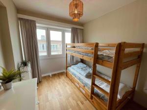 En eller flere senge i et værelse på Magnifique appartement vue sur plage