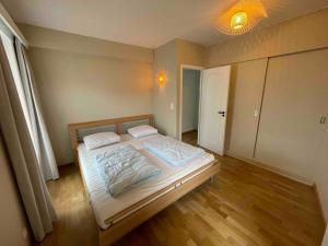 En eller flere senge i et værelse på Magnifique appartement vue sur plage