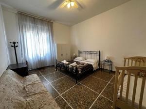 Łóżko lub łóżka w pokoju w obiekcie Holiday Pisa Gare