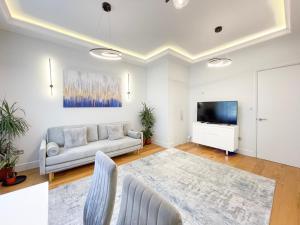 Μια τηλεόραση ή/και κέντρο ψυχαγωγίας στο Stylish One Bed Flat in Paddington Pool and gym next door Free secure underground parking nearby