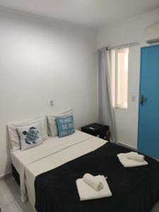 Postel nebo postele na pokoji v ubytování Suítes Paraty