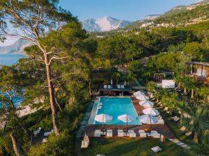 an aerial view of a resort swimming pool with umbrellas at Lov Faralya Adults Only in Faralya