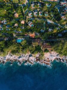 an aerial view of a village on the edge of the ocean at Lov Faralya Adults Only in Faralya