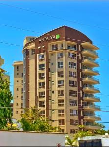 a building with an amtrak sign on top of it at Nyali Luxury Apartments, Antalya in Mombasa
