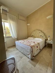 Postel nebo postele na pokoji v ubytování Hotel Bagni Lido
