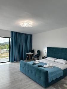 Postel nebo postele na pokoji v ubytování Green Heaven Resort Gorj