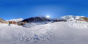 a snow covered ski slope with mountains in the background at Hotel Bristol in Saas-Fee +51 photos