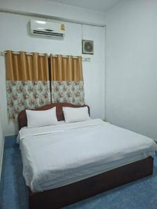 Ένα ή περισσότερα κρεβάτια σε δωμάτιο στο Khopchai Guesthouse