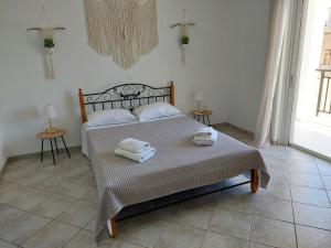 Ένα ή περισσότερα κρεβάτια σε δωμάτιο στο Denaxas Apartments 2