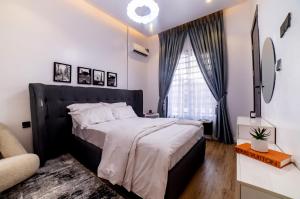 Postel nebo postele na pokoji v ubytování Canar's Suites