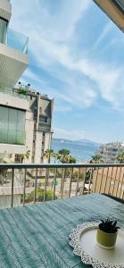 a table on a balcony with a view of the ocean at Mariola Vista Mar in Calpe