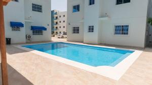 a large swimming pool in the middle of a building at Vista Azul Boca Chica Accommodation in El Higo
