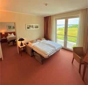 Postel nebo postele na pokoji v ubytování ATLANTIC Hotel Wilhelmshaven