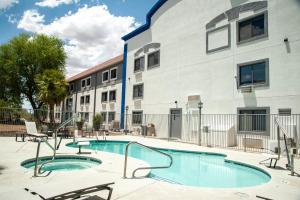 a swimming pool in front of a building at Holiday Inn Express Tucson-Airport by IHG in Tucson