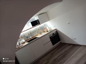 A kitchen or kitchenette at A Casa di Fede