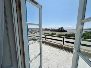 an open window with a view of the beach at Savoy Hotel in Weston-super-Mare +8 photos