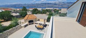 an aerial view of a house with a swimming pool at Villa Emma - luksuzna kuća s bazenom Wellness & SPA in Ražanac