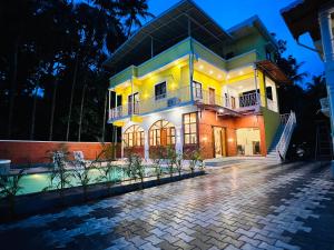 a house with a brick driveway in front of it at The Betelnut A Boutique Stay in Nagaon