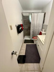 a small bathroom with a toilet and a sink at Riviera Haven, 10 Minutes from the Beach, Coastal Town, Quaint & Comfy in Riviera Beach