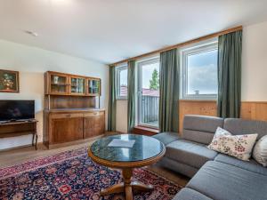 a living room with a couch and a table at Apartment Maisonette by Interhome in Sankt Paul