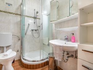 a bathroom with a shower and a sink and a toilet at Apartment Simonhöhe-4 by Interhome in Sankt Paul