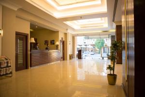 a lobby of a hotel with a reception desk at Travellerinn Serviced Apartment in Al Khobar +119 photos