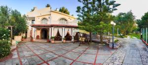 a house with a large patio in front of it at Casale Degli Angeli in Vieste