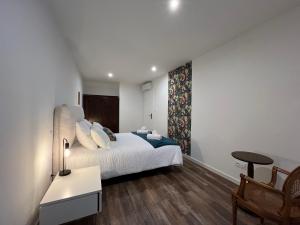 Postel nebo postele na pokoji v ubytování La Cour de Mamama Appartement 7