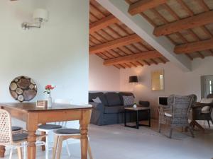 a living room with a couch and a table at La Giravolta Country House in Barchi