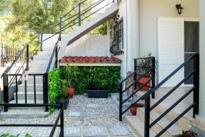 a set of stairs leading to a house at Gray House Salamina in Salamina