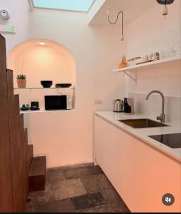 Cuisine ou kitchenette dans l'établissement CoDe24