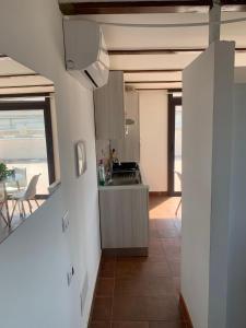 a kitchen with a sink and a counter top at luxury ciccy apartment in Reggio di Calabria