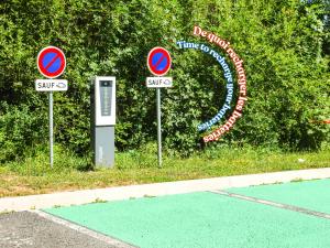 two street signs on the side of a road at ibis budget Rodez in Rodez