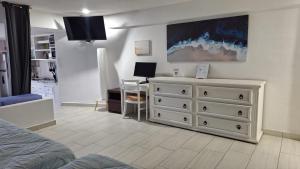 Televiisor ja/või meelelahutuskeskus majutusasutuses Puerto Vallarta Condo Frente al mar