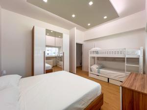 Ένα ή περισσότερα κρεβάτια σε δωμάτιο στο Beach Luxury Home