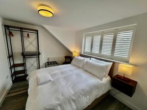 Ένα ή περισσότερα κρεβάτια σε δωμάτιο στο Penthouse North Sea Front +10 φωτογραφίες