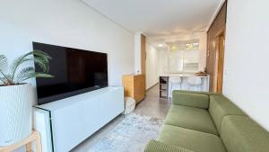 Μια τηλεόραση ή/και κέντρο ψυχαγωγίας στο Comfy Apartment Del Cura