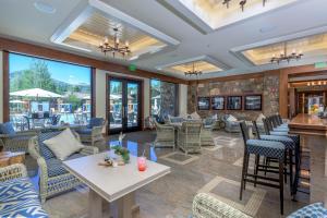 a lobby of a restaurant with chairs and tables at Dollar Meadows 1372 in Sun Valley
