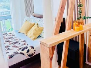 a staircase with a bed in a room at Perfect Staycation at Abreeza Mall with Kitchen, Netflix, Resort-style Pool - Davao Stay Suites T2-815 in Davao City +25 photos