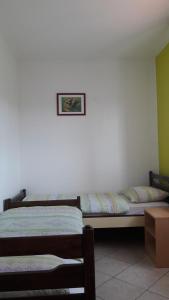 Postel nebo postele na pokoji v ubytování Apartments Tea