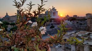 a view of the city at sunset at Residenza Maritti Decò Style- Guesthouse in Rome