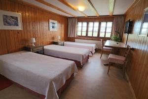 Postel nebo postele na pokoji v ubytování Hotel am Schönenbühl