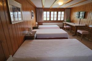 Postel nebo postele na pokoji v ubytování Hotel am Schönenbühl