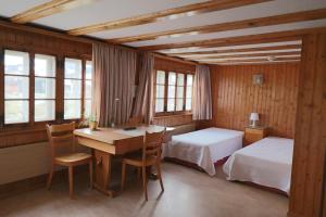 Postel nebo postele na pokoji v ubytování Hotel am Schönenbühl