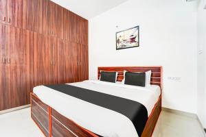 Postel nebo postele na pokoji v ubytování Super Hotel O Aarapalayam